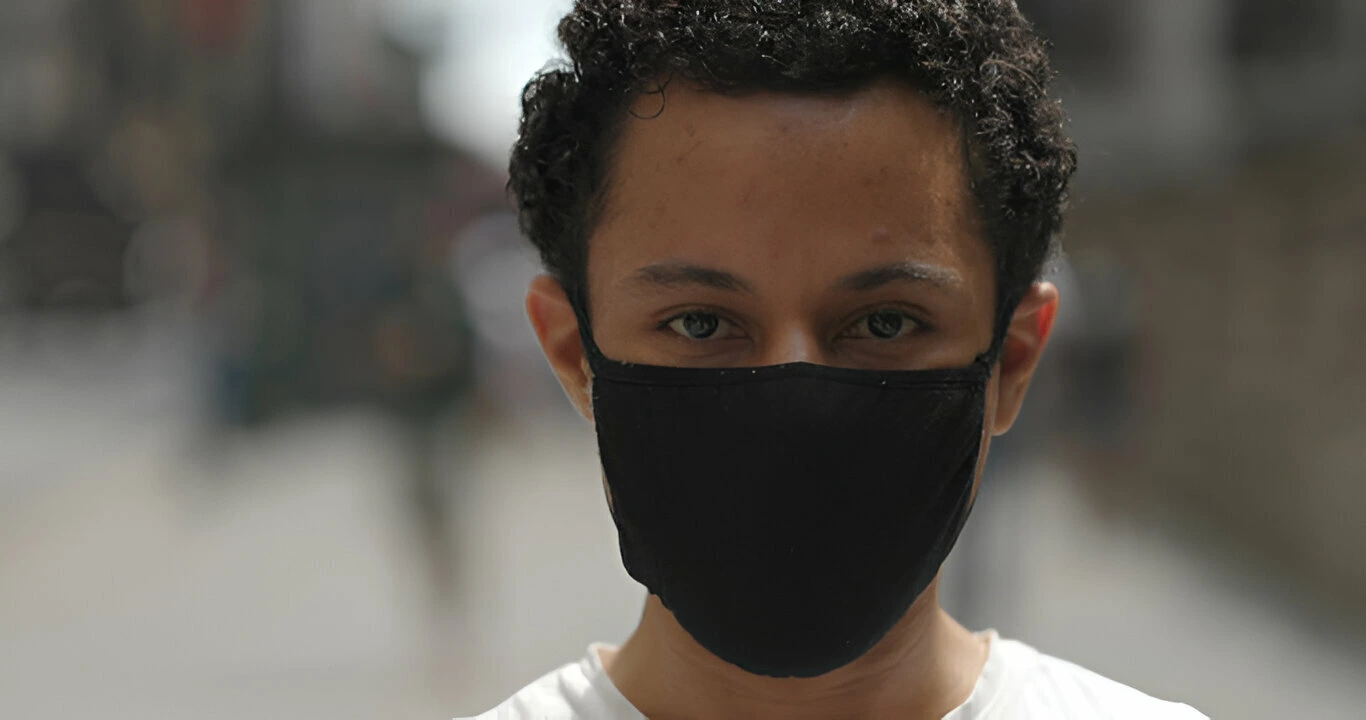 man in city face portrait wearing mask